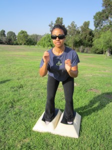 Squat Run beginning position. You may want to try dropping closer to heels to increase the muscle activity. As you run in and out of the squat, try touching the foot pads when in full squat. Give yourself that extra challenge building your cardio and strength. 